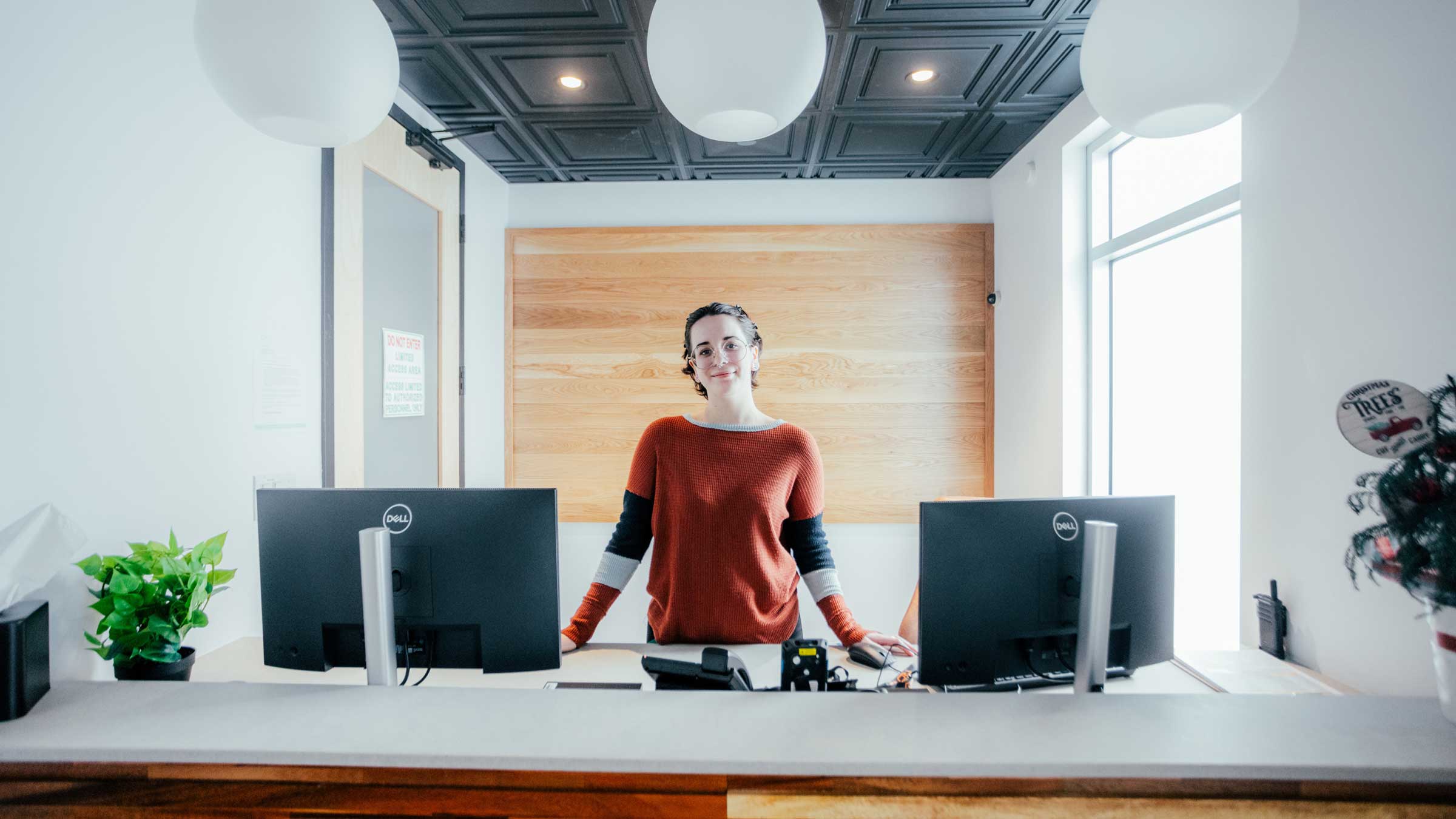 woman standing at desk